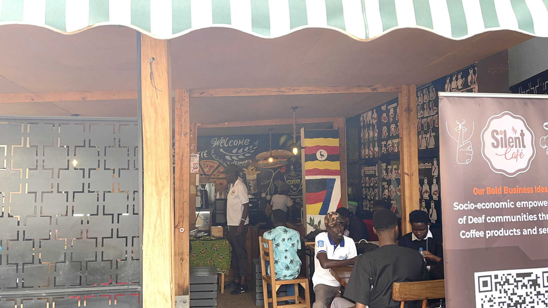 Steaming cup of premium coffee on rustic wooden table at Silent Café