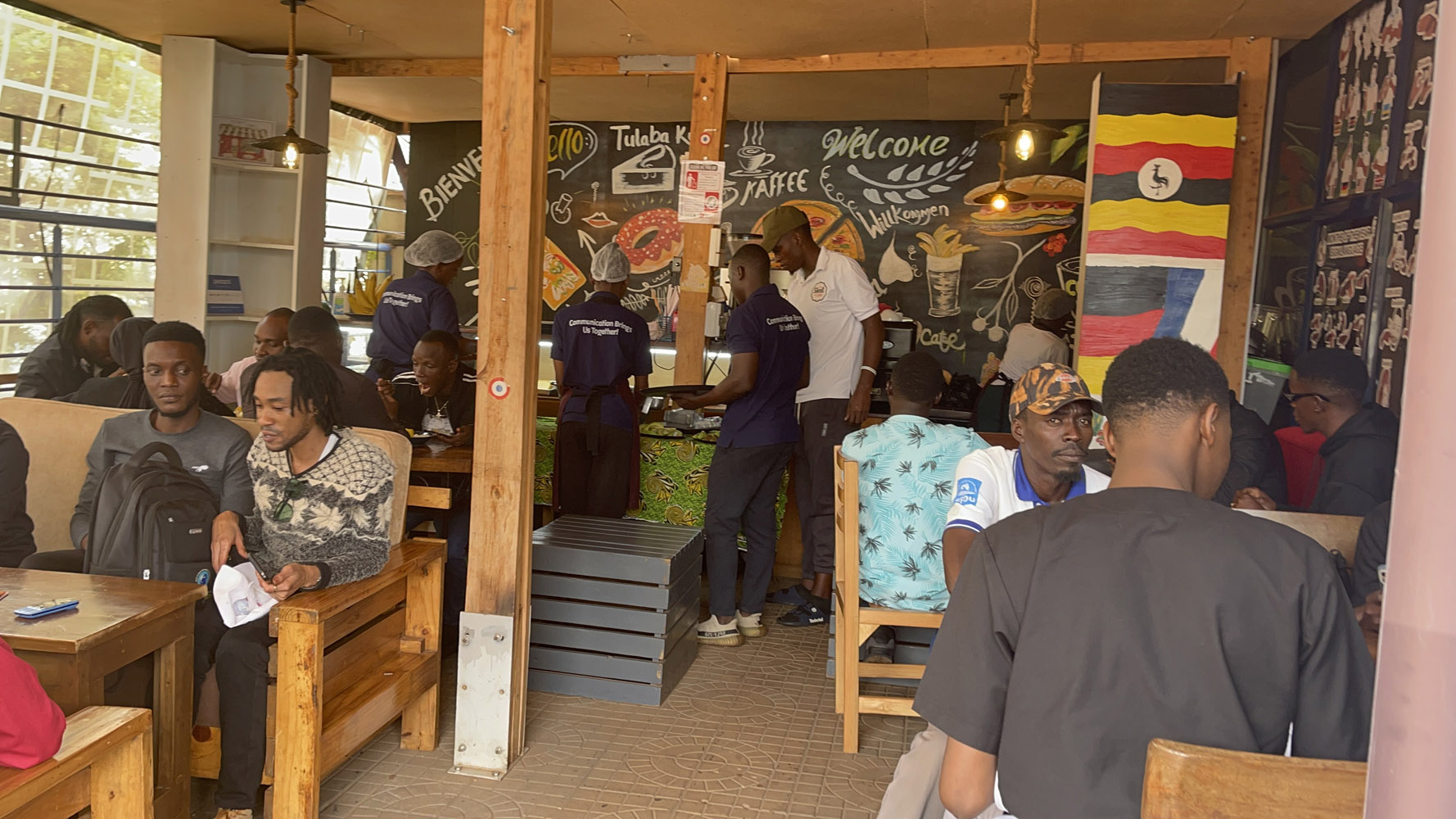 Diverse community members interacting and learning together at Silent Café